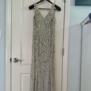 Light gray beaded evening gown. Size 4.